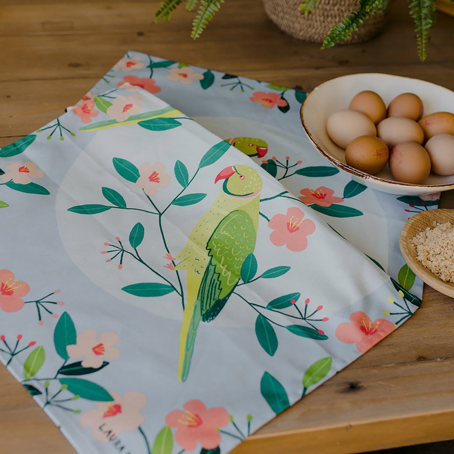 Paño de cocina de algodón orgánico con motivos de periquitos azules